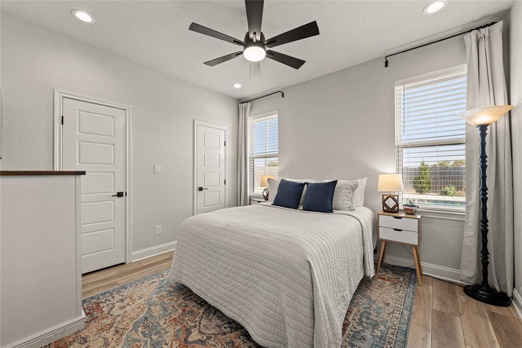 149 Water View Lane, Robinson, TX 76706 Recessed lighting, ceiling fan, wood-finish flooring, white paneled doors with black hardware, and two windows