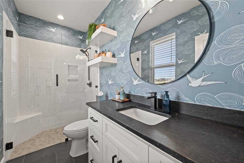 149 Water View Lane, Robinson, TX 76706 Walk-in shower with clear glass enclosure and integrated bench