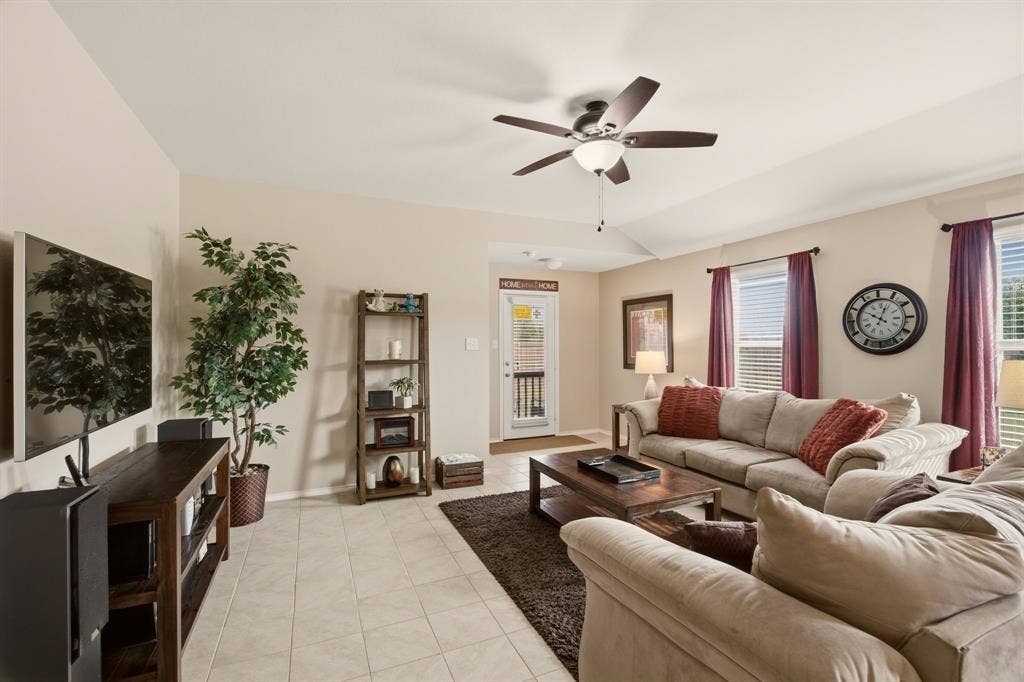 800 Amber Street, Princeton, TX 75407 Unlimited furniture placement options....just bring your comfy pieces to relax day or night. The seller added ceiling fans throughout too.