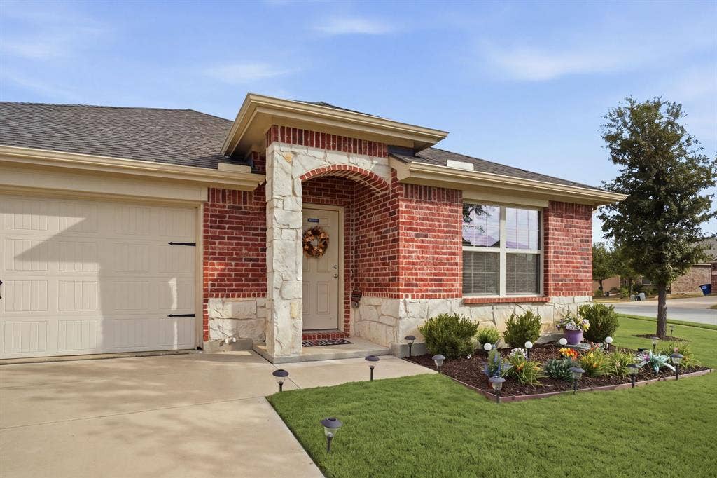 800 Amber Street, Princeton, TX 75407 Note the pretty landscaping the seller added.