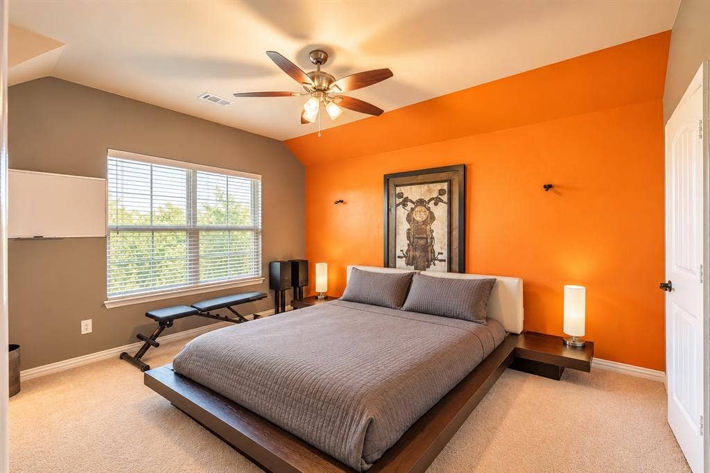 1704 Keswick Drive, McKinney, TX 75071 Carpeted room featuring a ceiling fan, window with horizontal blinds, and a paneled door