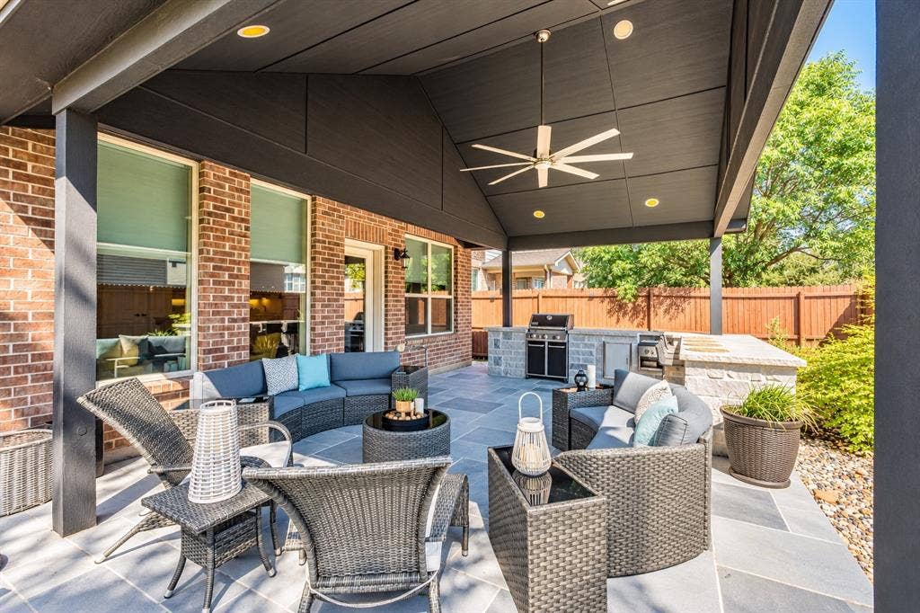 1704 Keswick Drive, McKinney, TX 75071 Expansive covered patio featuring a ceiling fan, recessed lighting, stone flooring, and a built-in outdoor kitchen with grill