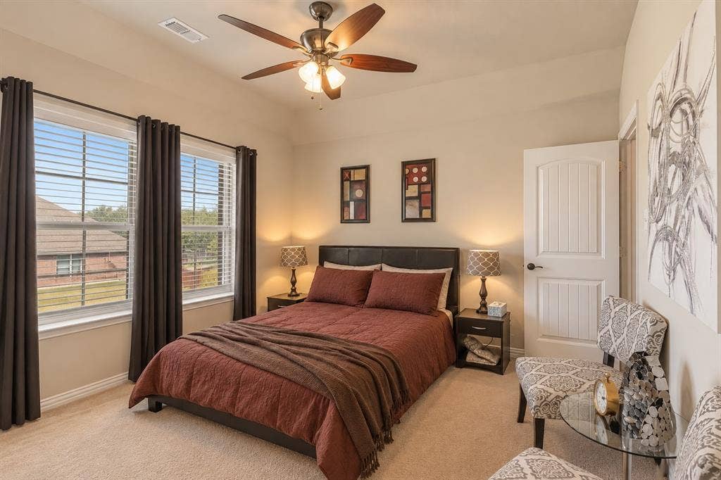 1704 Keswick Drive, McKinney, TX 75071 Recessed lighting, ceiling fan with integrated light fixture, dual windows with blinds and curtain rods, paneled interior door, and carpeted flooring