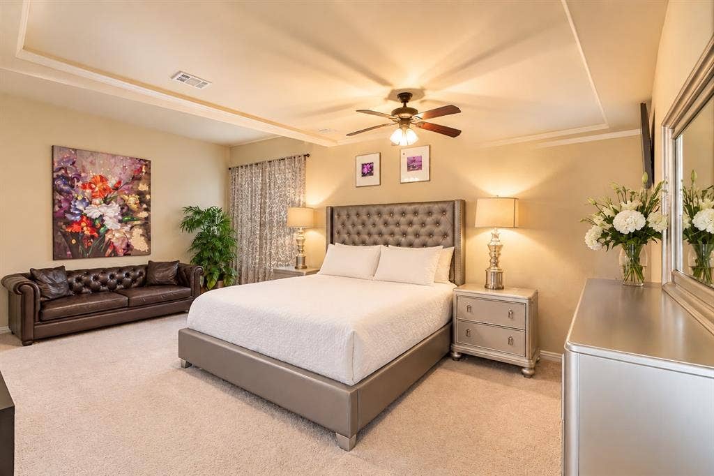 1704 Keswick Drive, McKinney, TX 75071 Tray ceiling with integrated lighting, recessed lighting, ceiling fan, and carpeted flooring