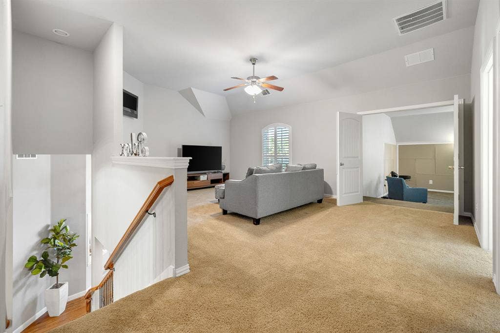 Upstairs gameroom or additional living space.