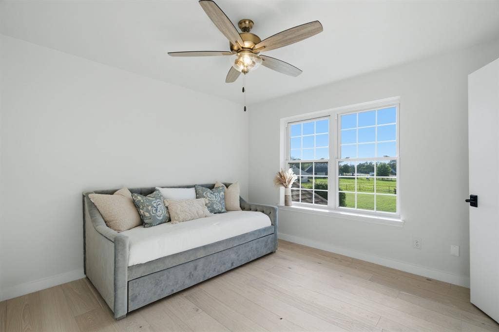 bedroom looks out over yard, pool, horses and longhorns