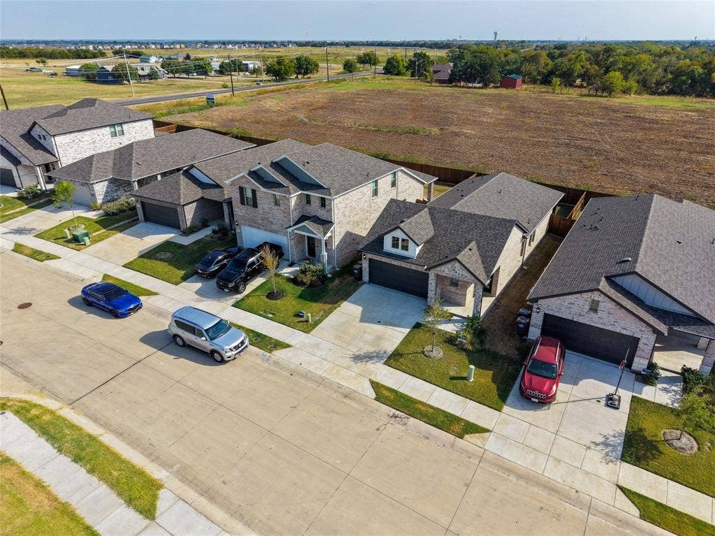 113 Greenbriar Drive, Princeton, TX 75071 Modern residential architecture with varied rooflines and a concrete driveway