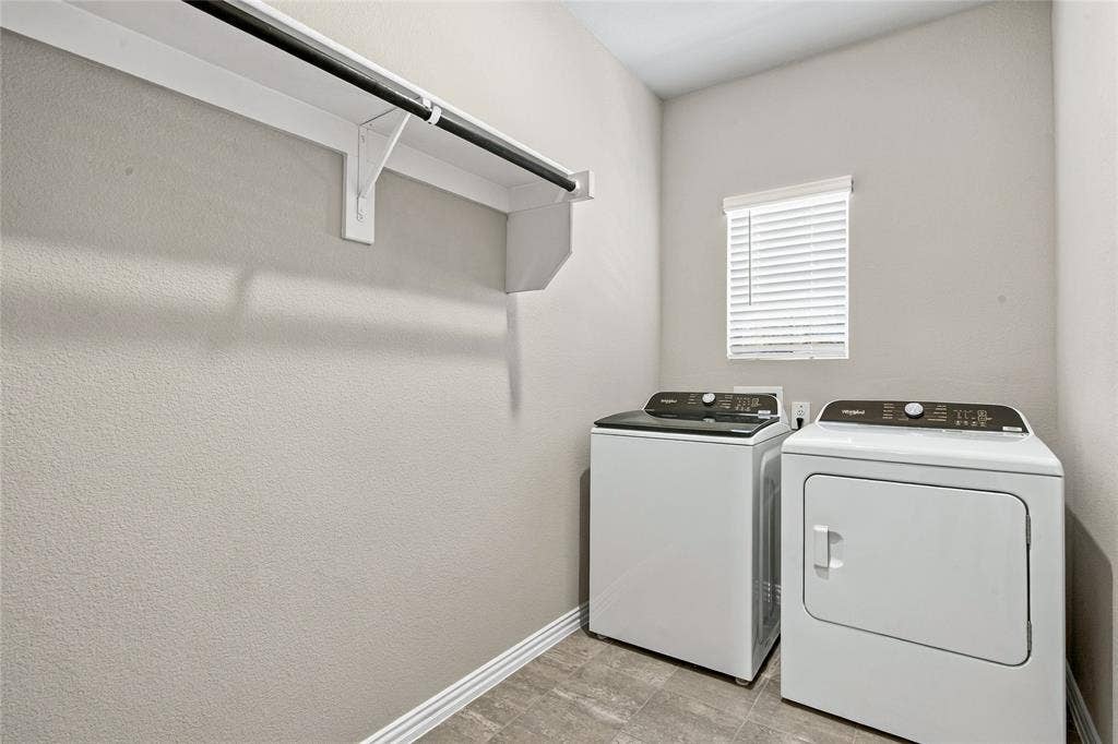 113 Greenbriar Drive, Princeton, TX 75071 White shelving with a dark-finish hanging rod, neutral-toned walls, and wood-finish flooring