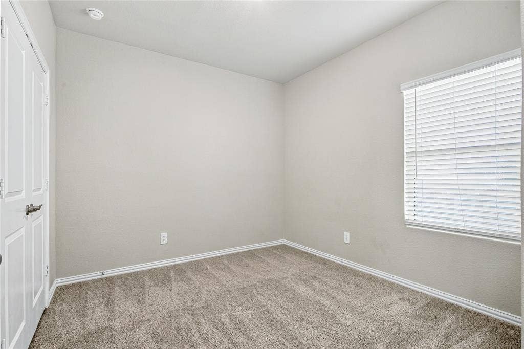 113 Greenbriar Drive, Princeton, TX 75071 Recessed ceiling light fixture, neutral wall paint, carpeted flooring, white trim, and a window with blinds