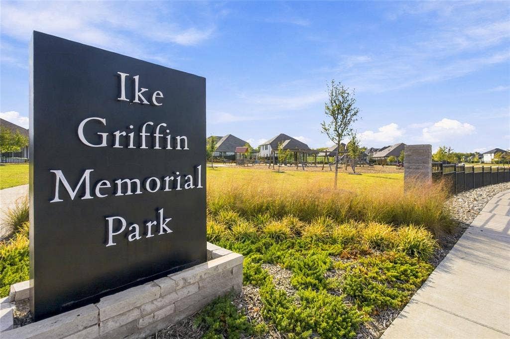 113 Greenbriar Drive, Princeton, TX 75071 Black monument sign with "Ike Griffin Memorial Park" lettering, stone base, concrete pathway, and landscaped grounds with grass and plantings