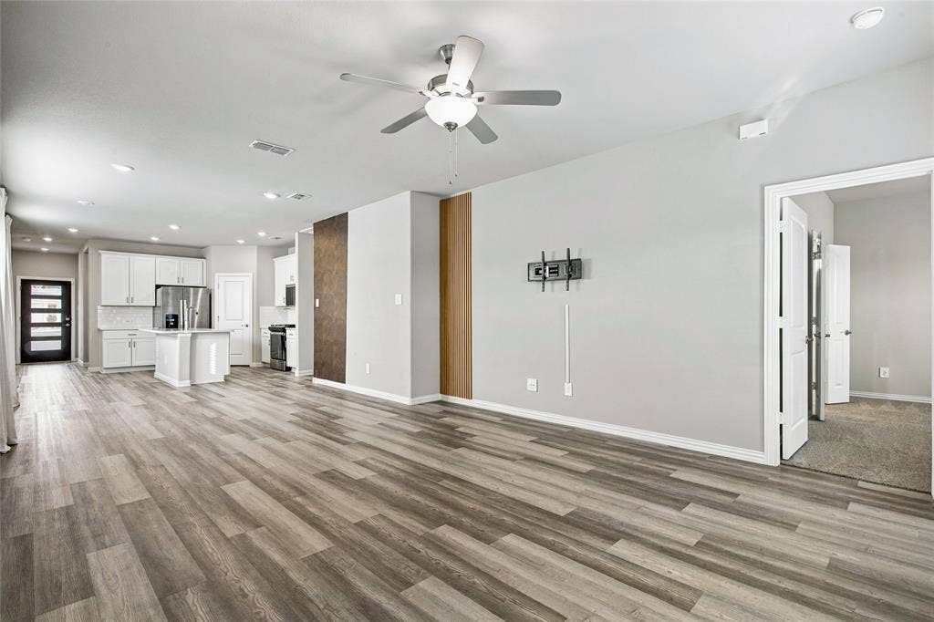 113 Greenbriar Drive, Princeton, TX 75071 Open-concept room featuring wood-finish flooring, recessed lighting, and a ceiling fan