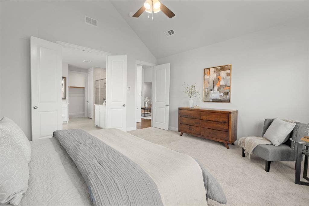 1320 Cartona Road, Fate, TX 75087 Vaulted ceiling with ceiling fan, light gray wall paint, and white trim