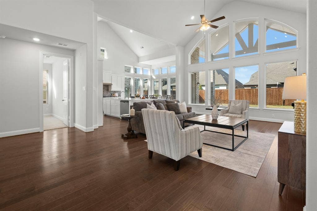 1320 Cartona Road, Fate, TX 75087 Vaulted Cathedral Style ceiling, Luxury vinyl wood-finish flooring, piucture window, and recessed lighting