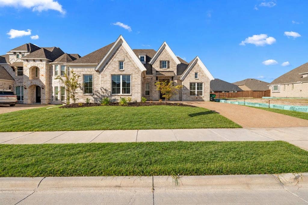 1320 Cartona Road, Fate, TX 75087 Light brick exterior with multiple gables