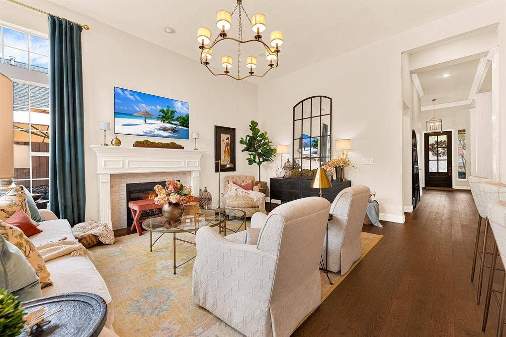 6429 GLENHOLLOW Drive, Plano, TX 75093 A refined Calcutta marble fireplace surround serves as the focal anchor, balancing clean architectural lines with gentle hearth warmth. Unwind during quiet evenings beside a glowing fire after a long day.