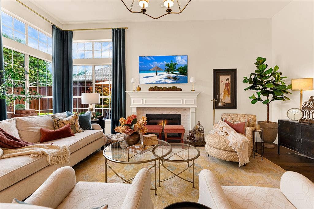 6429 GLENHOLLOW Drive, Plano, TX 75093 Floor-to-ceiling glass captures picturesque views of the backyard and pool, seamlessly connecting indoor comfort with outdoor scenery. Gather with family for cozy movie nights framed by sparkling patio vistas outside.