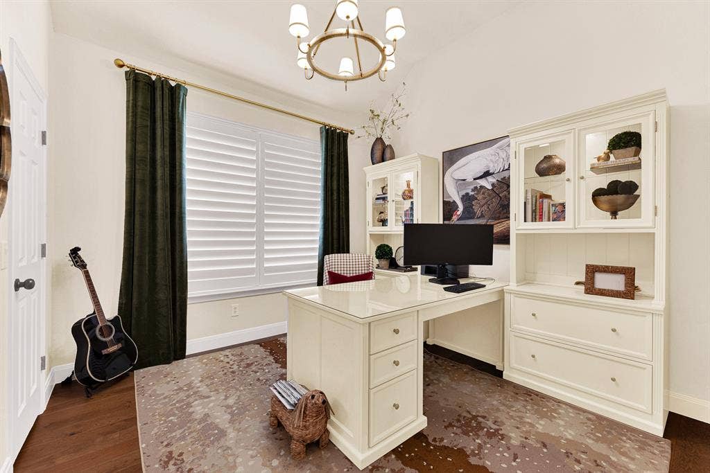 6429 GLENHOLLOW Drive, Plano, TX 75093 A grand picture window with plantation shutters bathes this versatile room in steady natural light beneath a classic central fixture. Visualize focusing on creative projects or working remotely in a quiet, sunlit workspace.