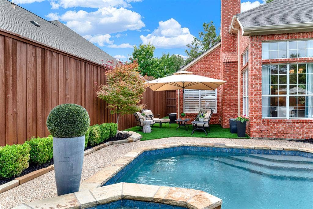 6429 GLENHOLLOW Drive, Plano, TX 75093 Curved pool contours harmoniously balance the surrounding patio areas and dark mulch garden borders. Take a refreshing dip on hot summer days before enjoying dinner alfresco under bright blue skies.
