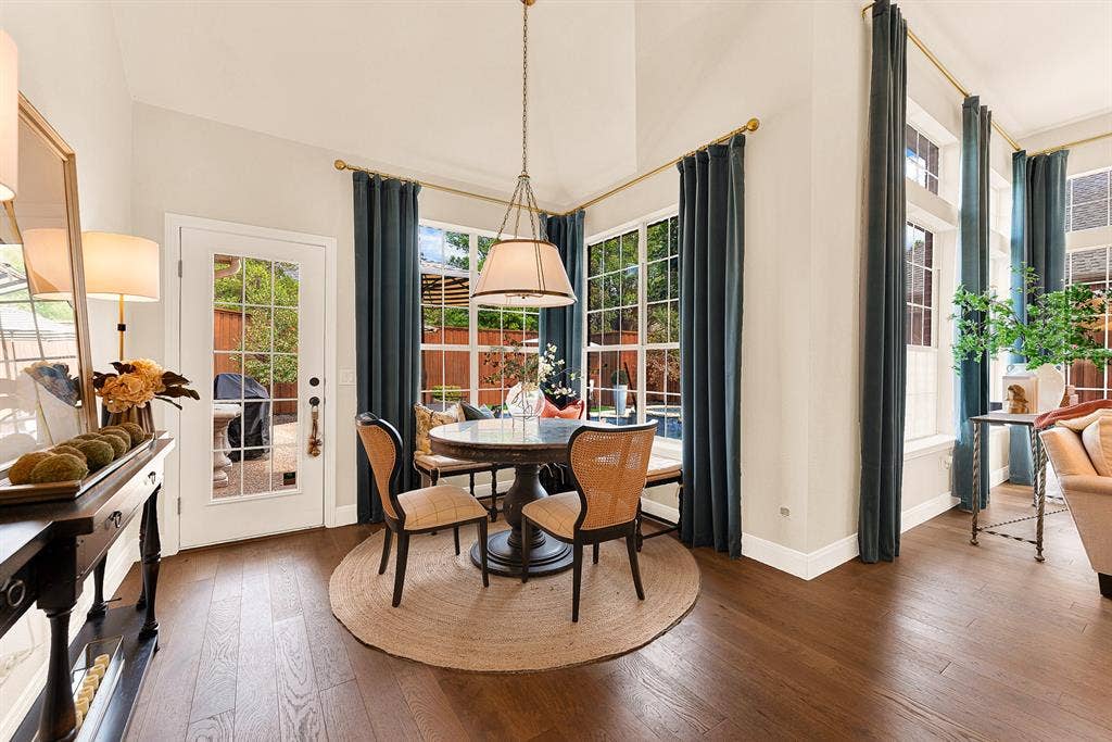 6429 GLENHOLLOW Drive, Plano, TX 75093 A cozy breakfast nook framed by tall windows offers direct views of the backyard and pool. Start peaceful weekend mornings with quiet coffee while watching sunlight dance across the sparkling water outside.