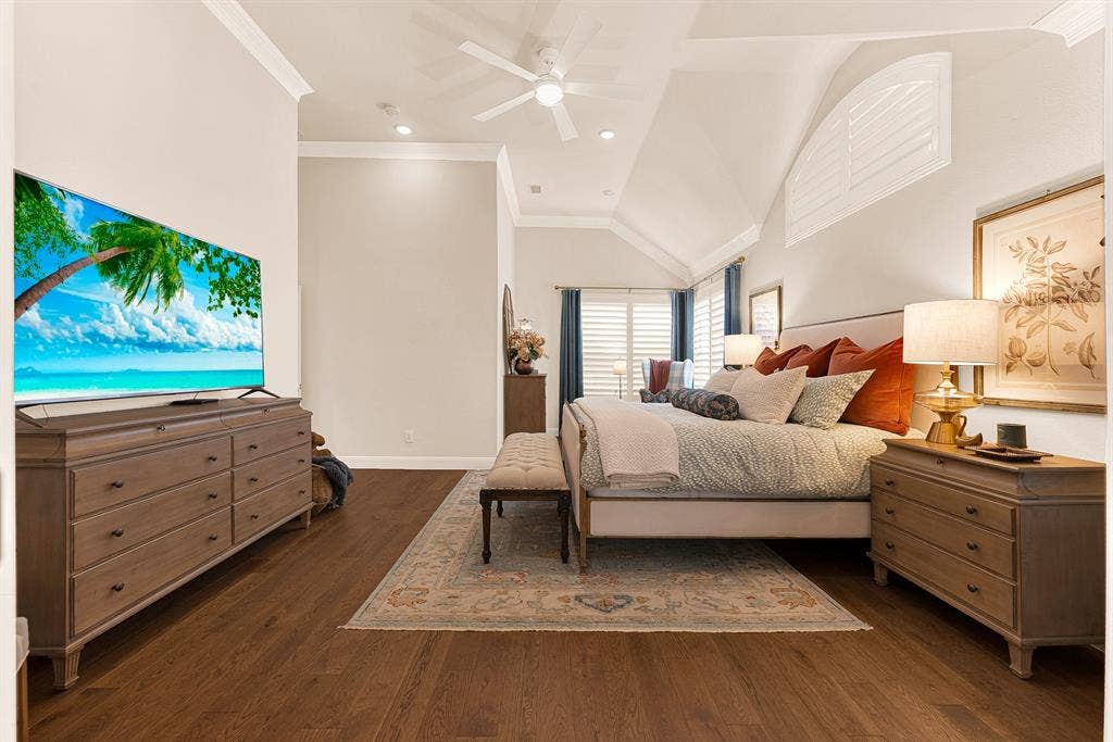 6429 GLENHOLLOW Drive, Plano, TX 75093 Gleaming hardwood floors and a tall tray ceiling give this primary suite impressive volume and dimension. Unwind in absolute peace as warm evening light settles across the room.