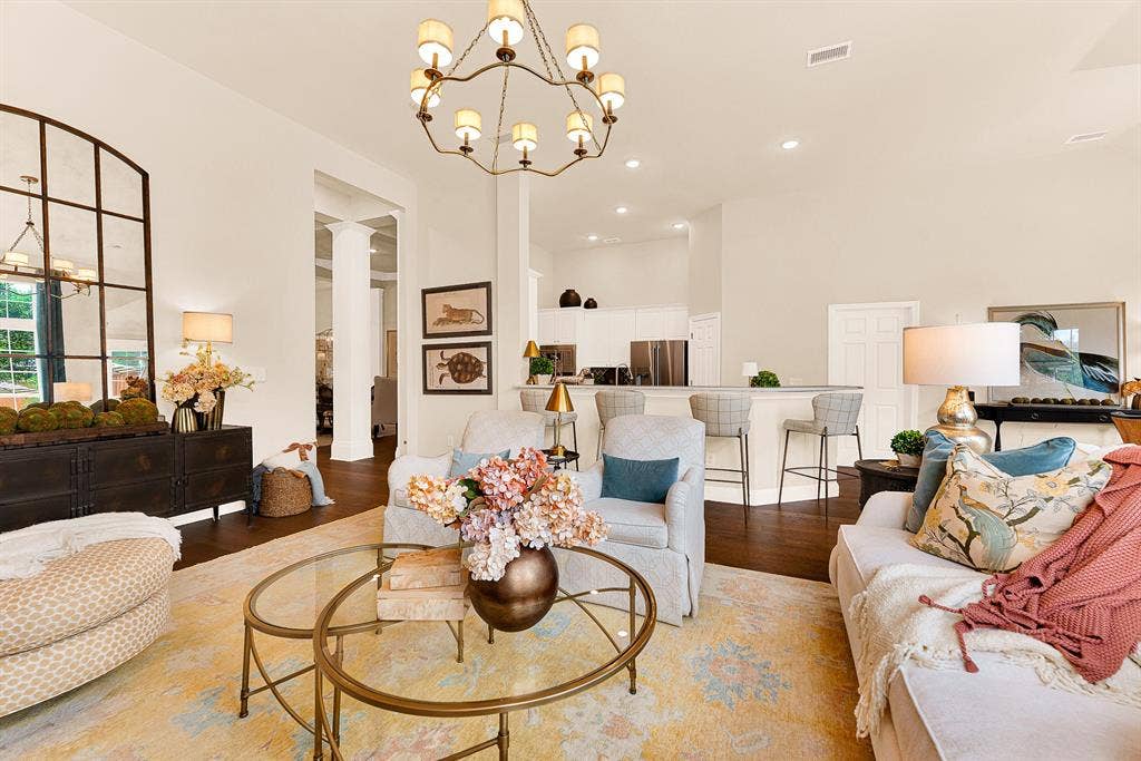 6429 GLENHOLLOW Drive, Plano, TX 75093 An airy, open layout links living and dining zones under soaring heights for seamless interior movement. Savor peaceful morning coffee while early light fills the open living space.