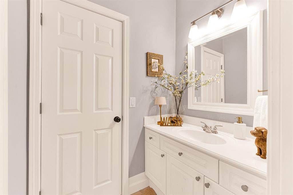 6429 GLENHOLLOW Drive, Plano, TX 75093 A guest bath remodeled in 2025 offers a bright vanity space enhanced by refined trim molding and soft overhead lighting. Help visitors feel pampered with a refreshing, spa-like start to their day.