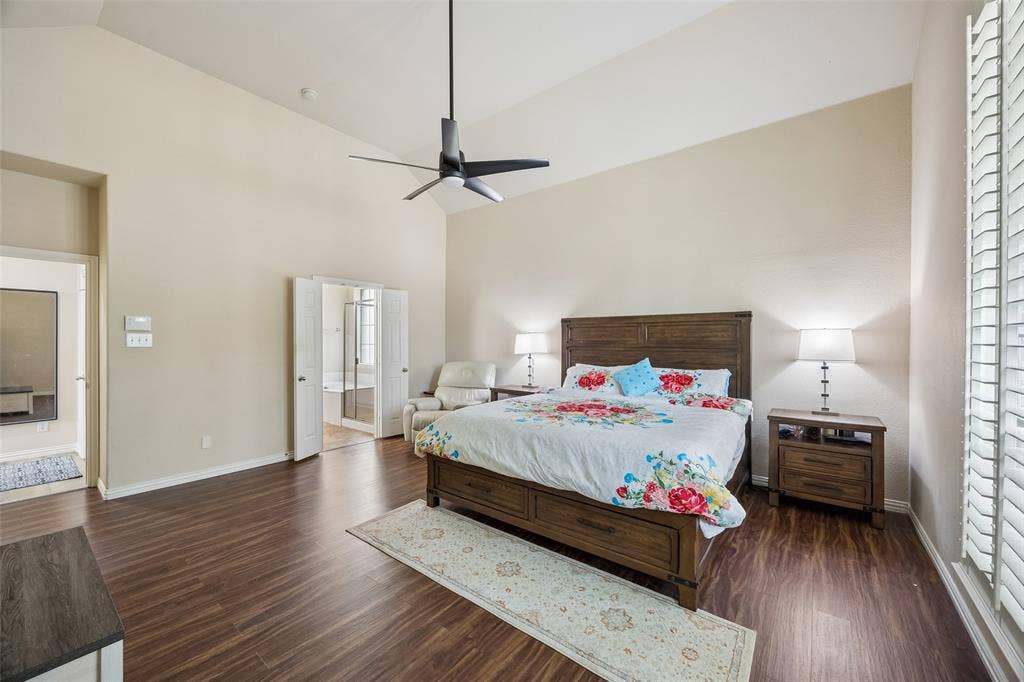 2865 Ridge View Road, Frisco, TX 75034 Vaulted ceiling with a ceiling fan, wood-finish flooring, plantation shutters, and double doors