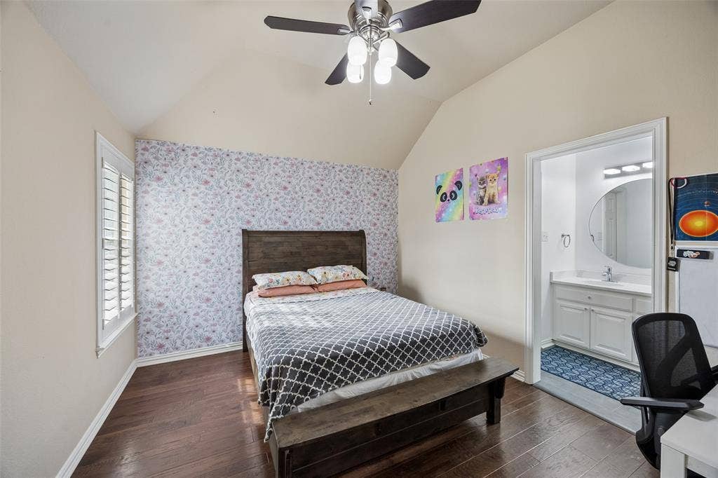 2865 Ridge View Road, Frisco, TX 75034 Vaulted ceiling with a ceiling fan, wood-finish flooring, and white window shutters