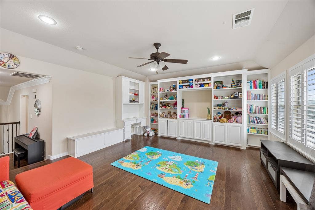2865 Ridge View Road, Frisco, TX 75034 Hardwood-finish flooring, built-in shelving, white plantation shutters, recessed lighting, and a ceiling fan
