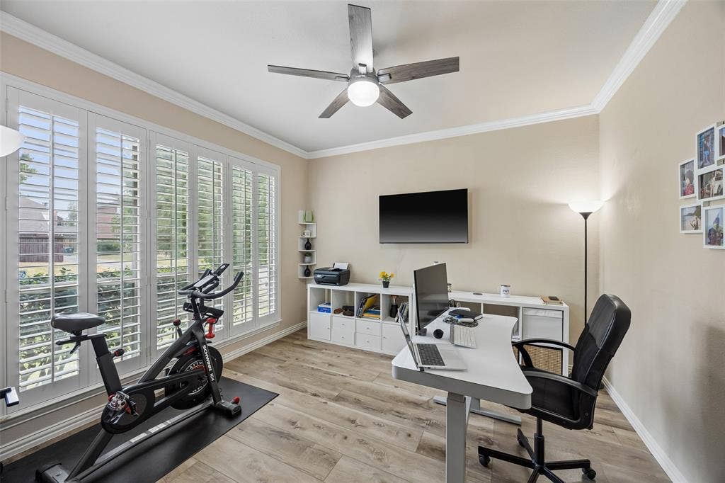 2865 Ridge View Road, Frisco, TX 75034 Light wood-finish flooring, white plantation shutters, and crown molding