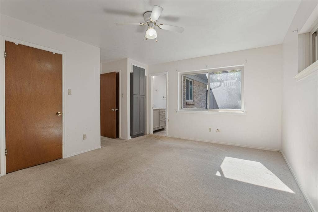 Neutral-toned carpeting throughout