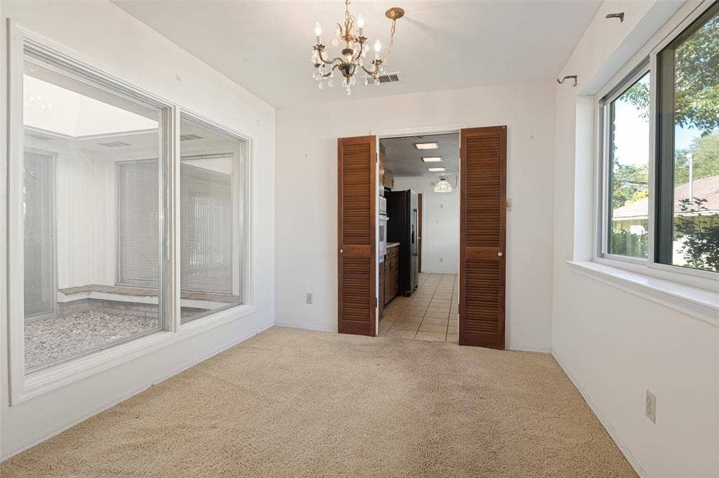 White walls and light-toned carpet