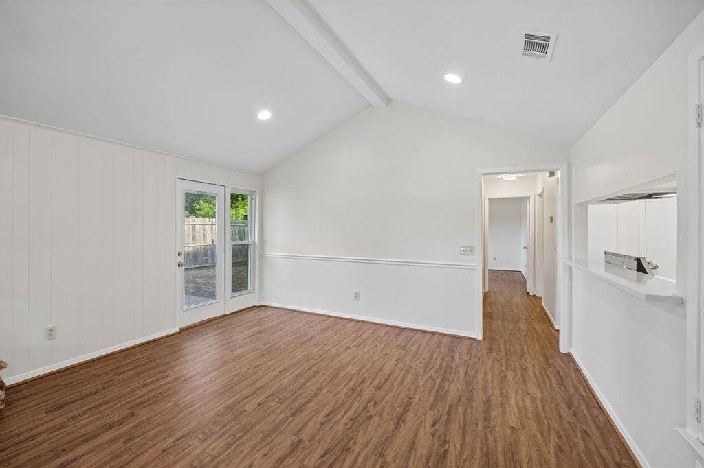 1613 19th Street, Plano, TX 75074 Vaulted ceilings, wood-finish flooring, recessed lighting, double glass doors, and a pass-through window