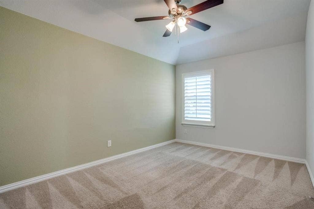6229 Gloucester Drive, Celina, TX 76227 Carpeted room with vaulted ceiling and a ceiling fan