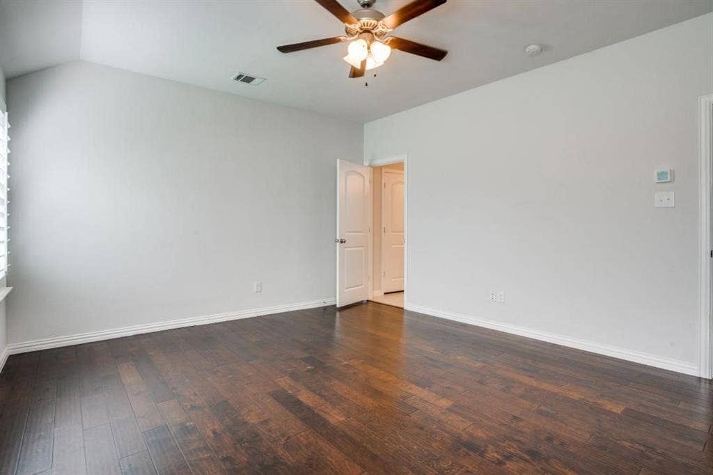 6229 Gloucester Drive, Celina, TX 76227 Vaulted ceiling, wood-finish flooring, ceiling fan, white interior doors, and window with blinds