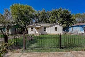 7729 Hillard Drive, Dallas, TX 75217 White siding exterior featuring a covered entry