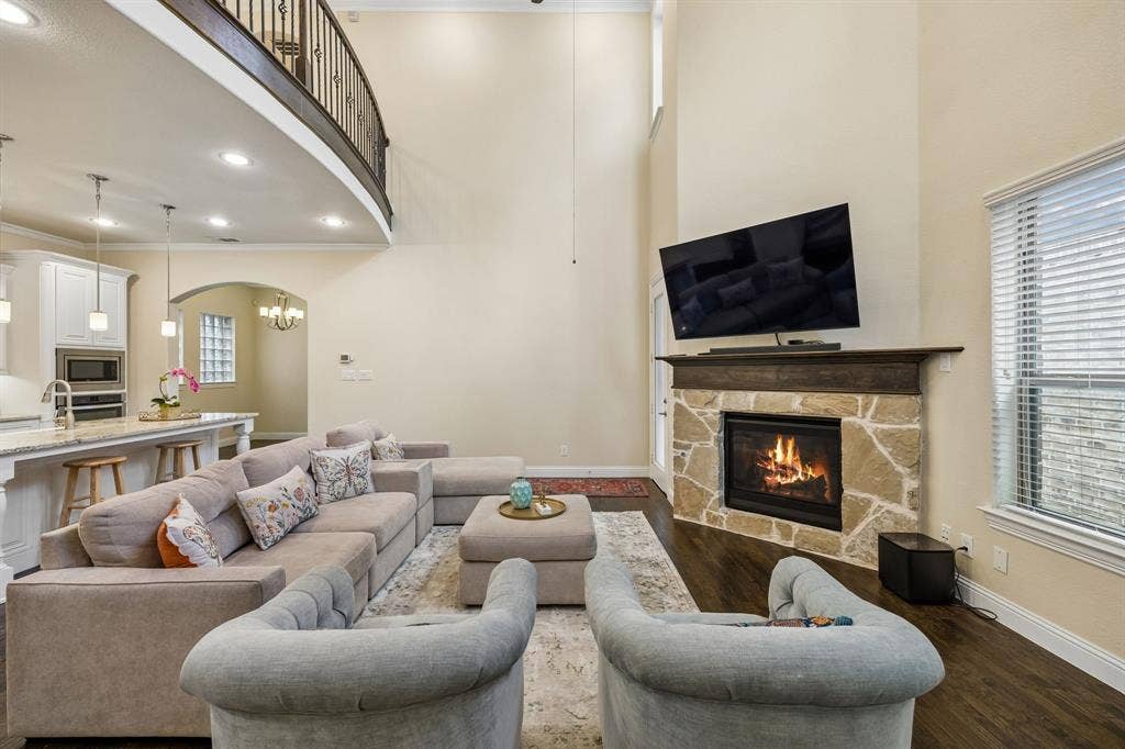 Living room with view of kitchen and gas fireplace
