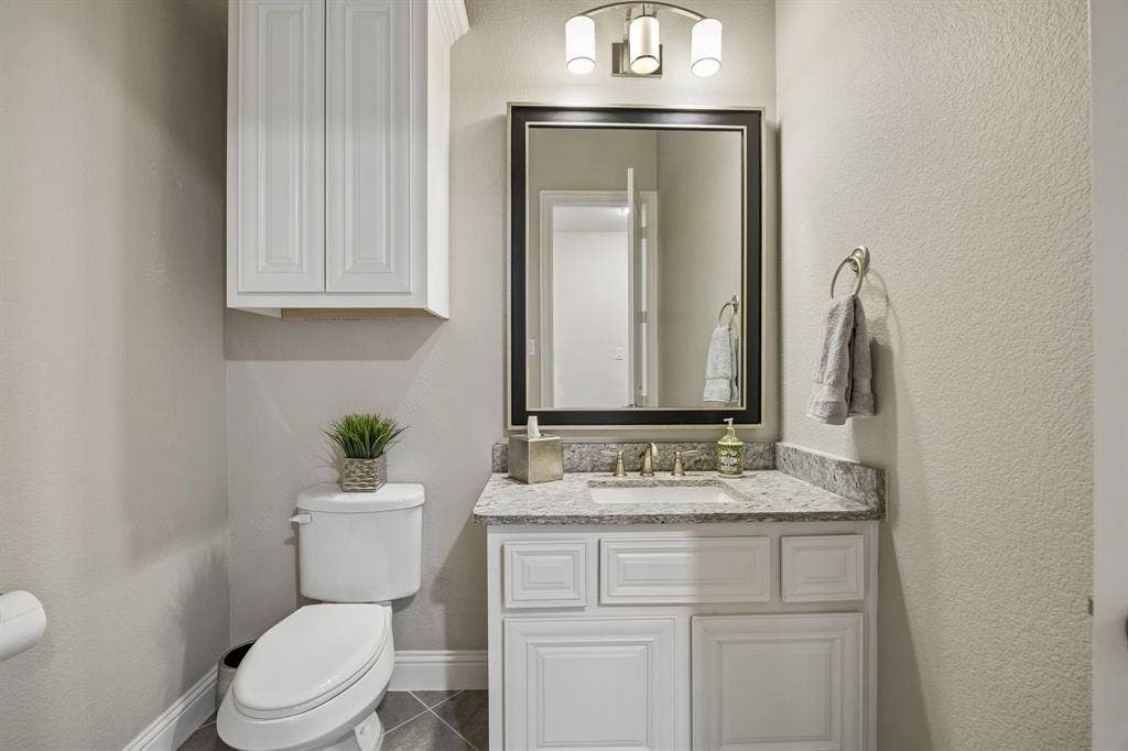 Downstairs powder bathroom with granite