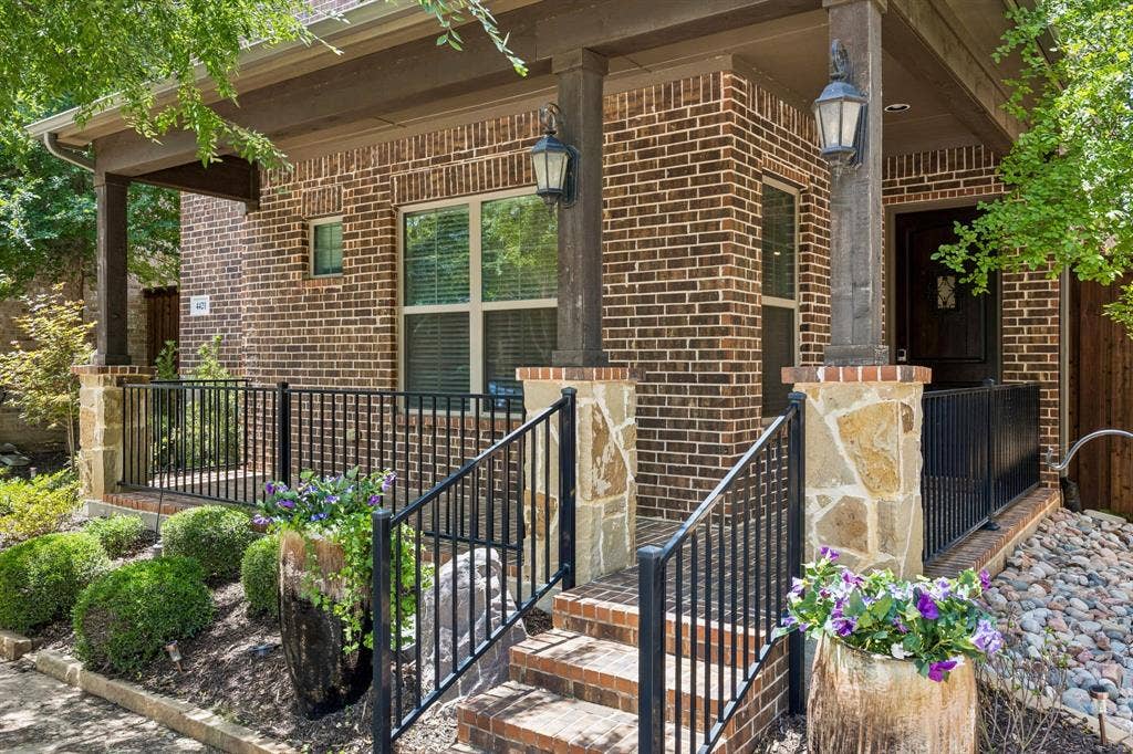 Stairs leading to front entry and covered porch