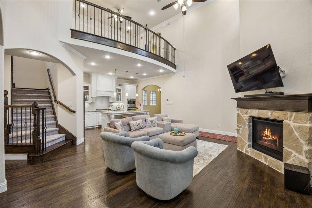 Living room with soaring ceilings offering abundant natural light