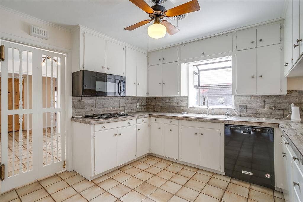 Kitchen featuring white cabinetry, tile flooring, built-in microwave, gas range, and a dishwasher