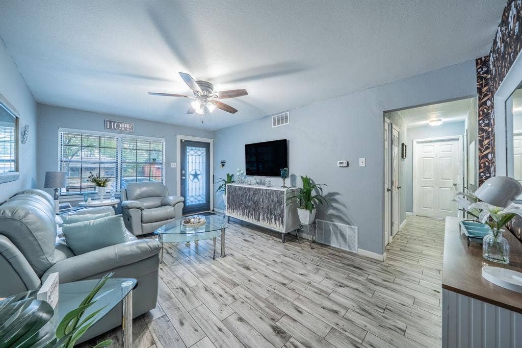 1938 Balla Way, Grand Prairie, TX 75051 Wood-finish flooring, ceiling fan, multiple windows with blinds, recessed lighting, and a paneled interior door