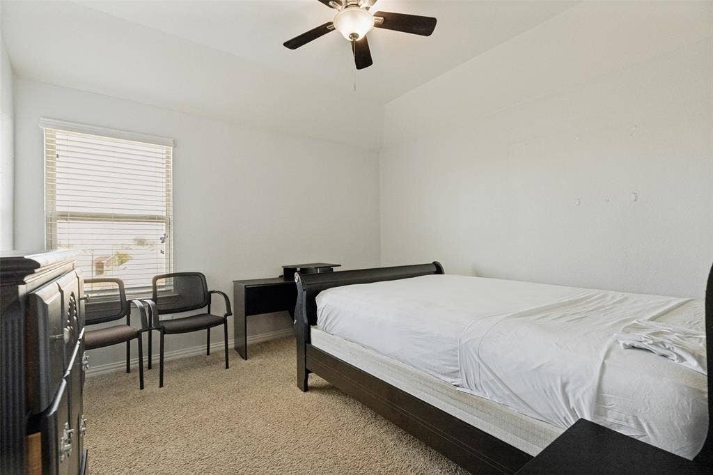 818 Black Hawk Drive, Princeton, TX 75407 Wall-to-wall carpeting and a window with blinds
