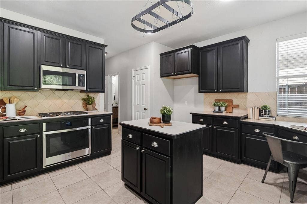 417 Rock Ridge Way, McKinney, TX 75072 View of Island with Electric outlet in it.