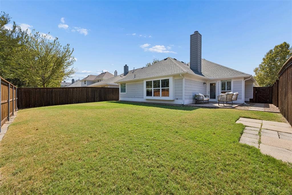 9828 Meadow Rue Drive, McKinney, TX 75072 Large fenced backyard with plenty of room for pets, play and outdoor entertaining.