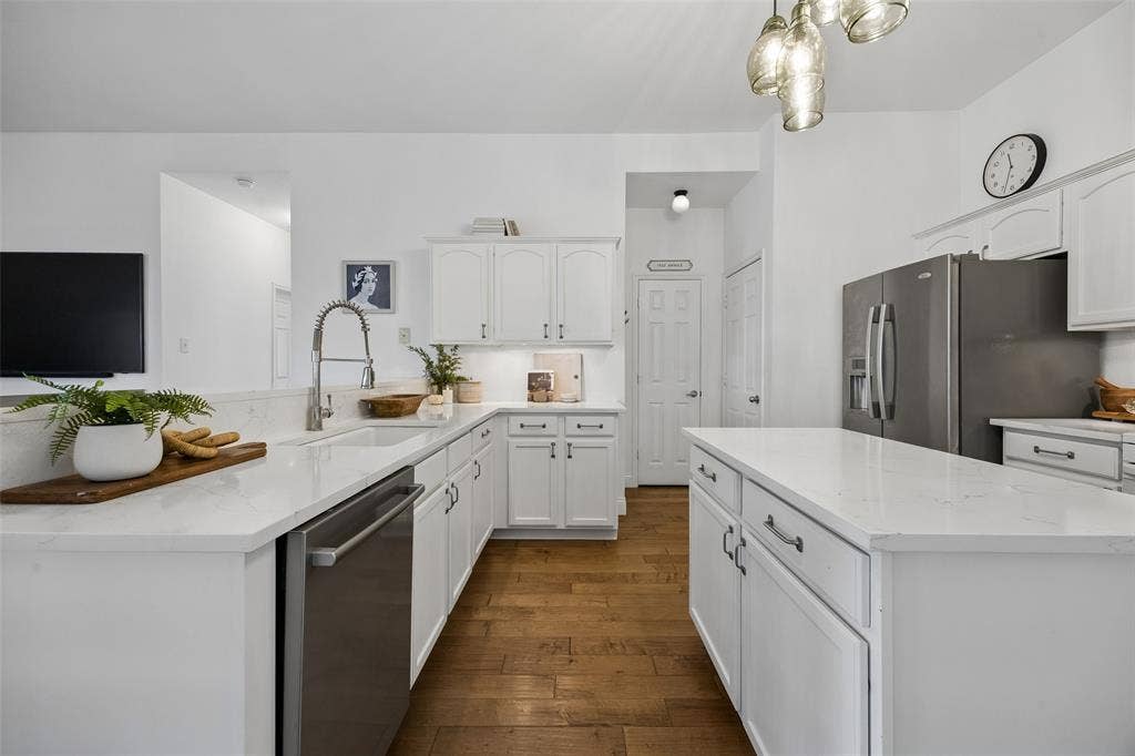9828 Meadow Rue Drive, McKinney, TX 75072 A subway tile backsplash and under cabinet lighting add style and function.