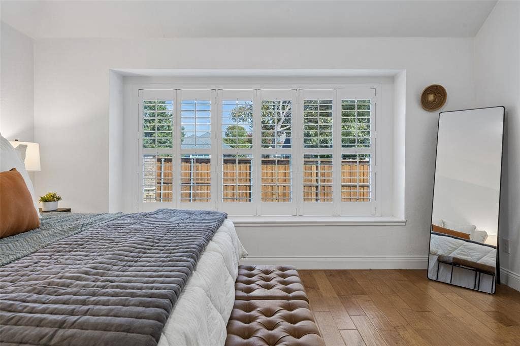 9828 Meadow Rue Drive, McKinney, TX 75072 Large windows with plantation shutters create a bright and relaxing atmosphere.