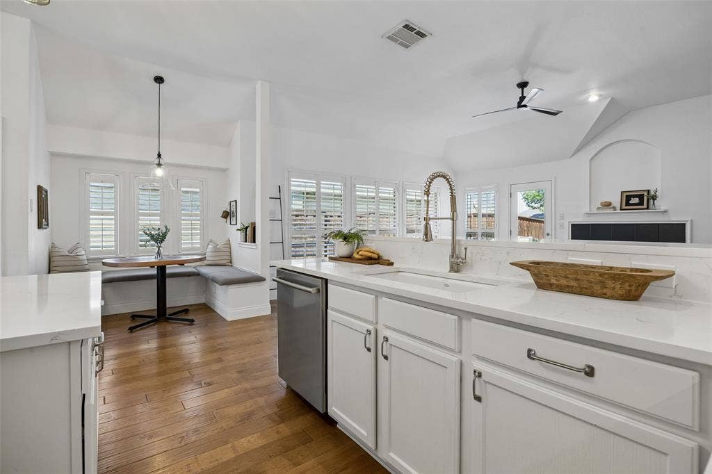 9828 Meadow Rue Drive, McKinney, TX 75072 A farmhouse sink, Stainless steel dishwasher, drawer and cabinet hardware, plus open to the everyday dining nook!