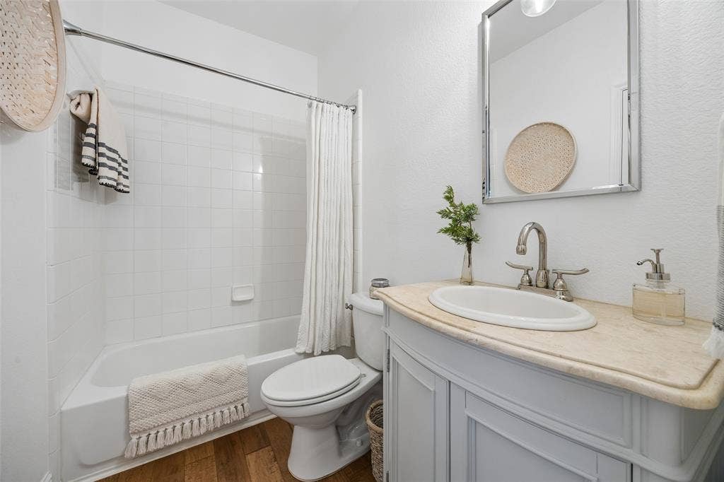 9828 Meadow Rue Drive, McKinney, TX 75072 Beautifully updated guest bathroom with fresh, modern finishes.