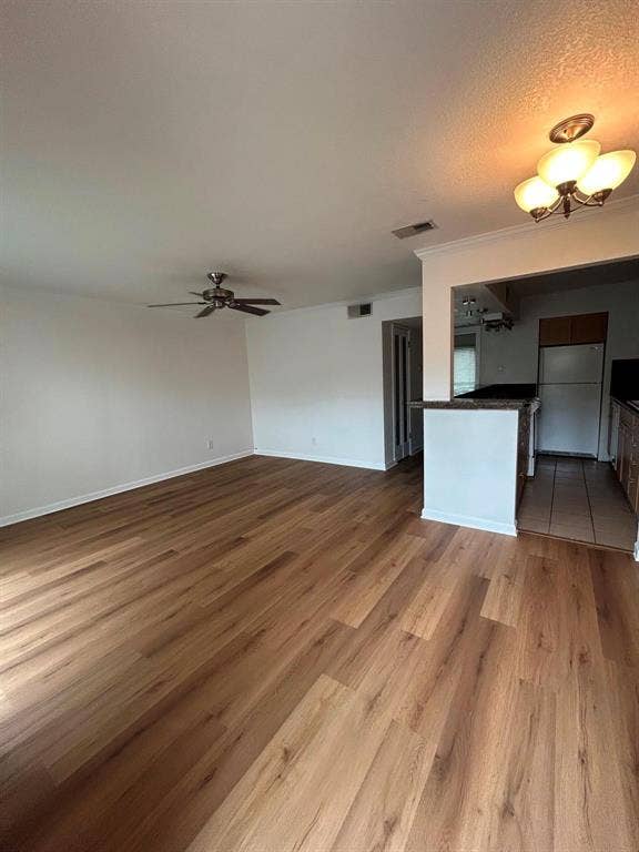 4112 Bowser Avenue, #210, Dallas, TX 75219 Wood-finish flooring, ceiling fan, crown molding, kitchen pass-through, and built-in lighting